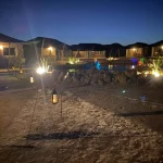 A mesmerizing view of the Agafay Desert Night Pass with stars illuminating the sky.