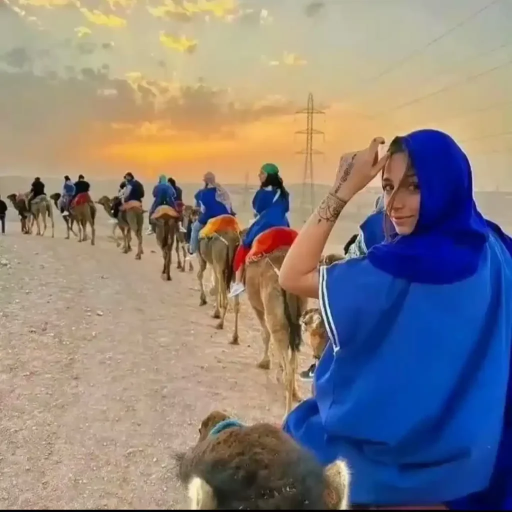 Unleash Your Inner Adventurer: Thrilling Activities and Relaxing Escapes in the Agafay Desert with Maroc Day Pass Maroc Day Pass Maroc day pass group of tourisdts having camel ride tour in agafay desert marrakech