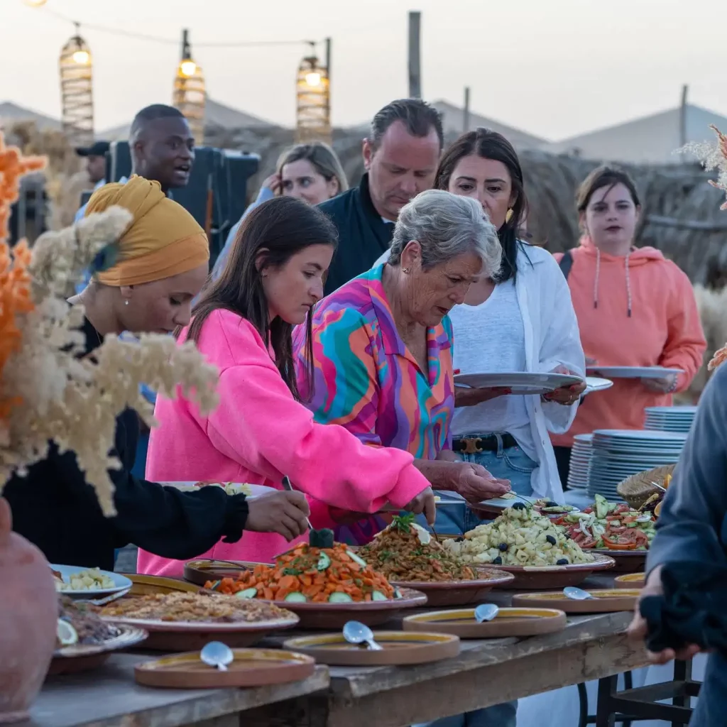 Unleash Your Inner Adventurer: Thrilling Activities and Relaxing Escapes in the Agafay Desert with Maroc Day Pass Maroc Day Pass group having tasty Magicall dinner in Agafay desert Marrakech Maroc day pass
