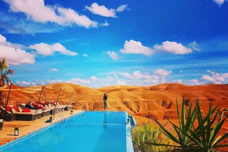 Beautiful view of the Piscine A Agafay swimming pool Agafay Luxury Camp against a backdrop of awe-inspiring Moroccan landscapes for a unique camping experience